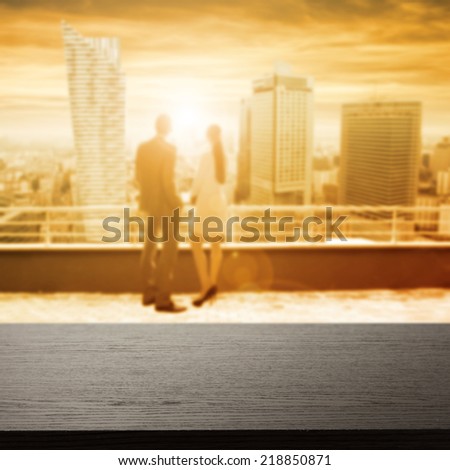 black desk sunset and man with woman