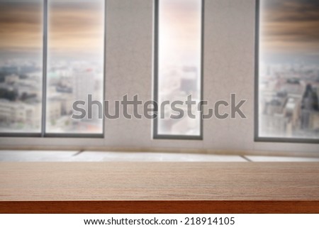 top of desk in office and landscape of city