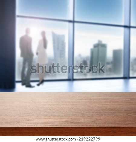 brown desk in office and window space