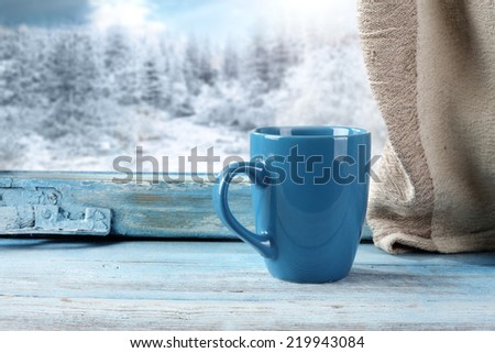 blue mug and blue window
