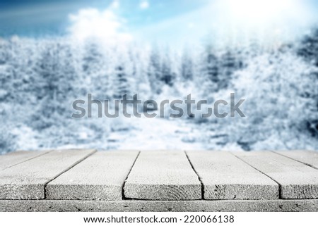 winter wooden table of snow and blue forest