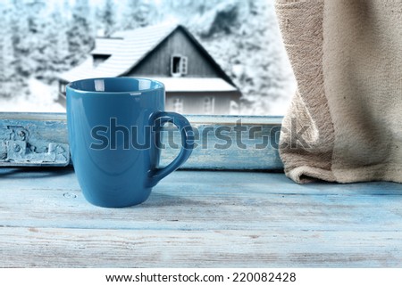single blue mug and window place