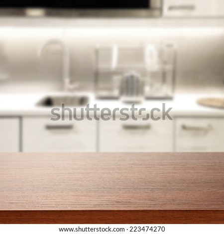 brown desk and kitchen place of white
