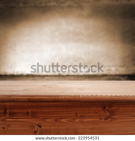 dark brown interior with shadows and desk