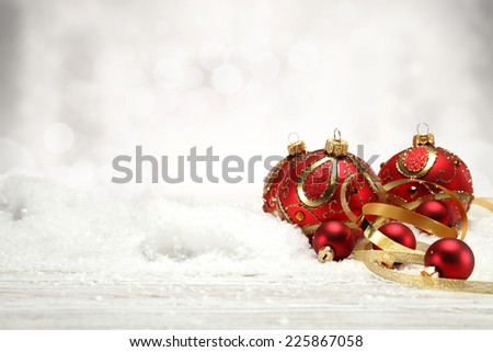 holiday decoration of red balls and golden ribbon