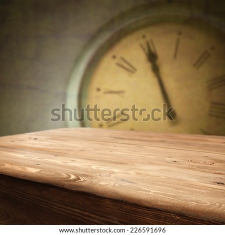 table of wood and old clock