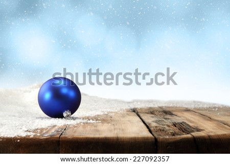 dirty old retro wooden table and one blue ball