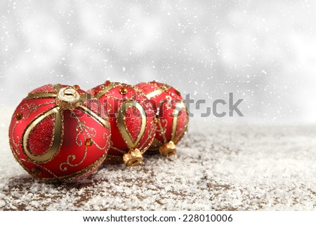 three red balls and desk of white snow