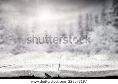 wooden table of winter snow and landscape space