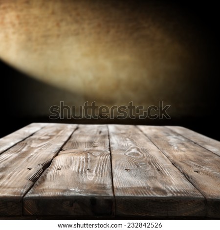 dark interior of home and worn table