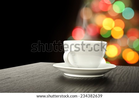 dark desk of coffee cup and xmas tree