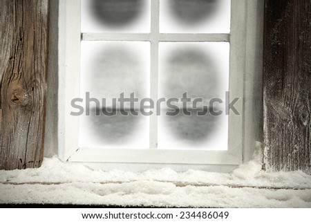 window of winter with snow and frost