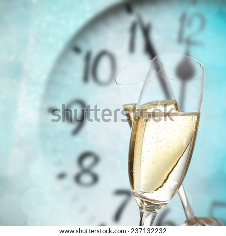 holiday time of new year and glasses of champagne and clock