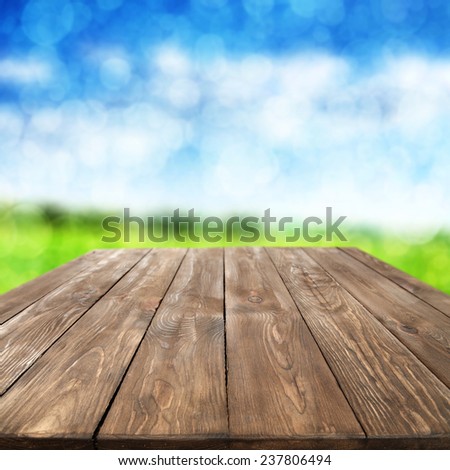 decoration of big old table in brown color and green grass