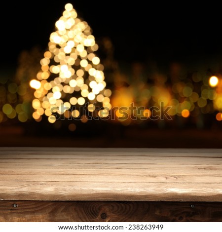 dark night xmas tree and wooden table place