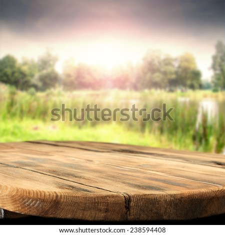 spring sun spring sky and wooden table