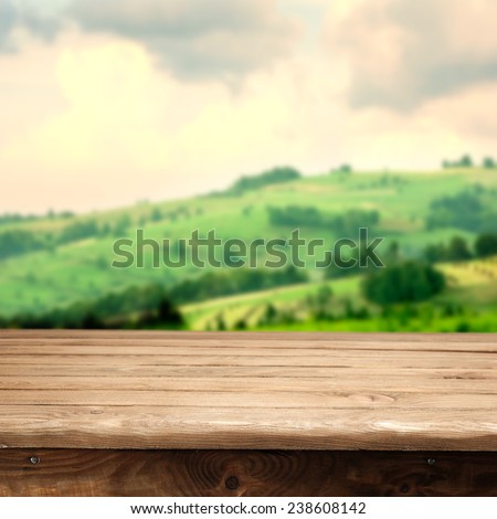 spring landscape of green tuscany and desk texture