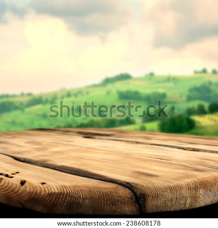 spring landscape of green tuscany and worn old texture table space