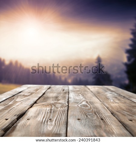 summer sky of sun and sunset and retro old table of brown