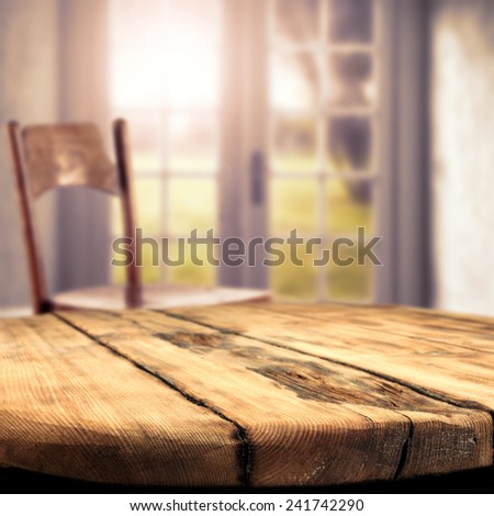 worn old table and window space of spring