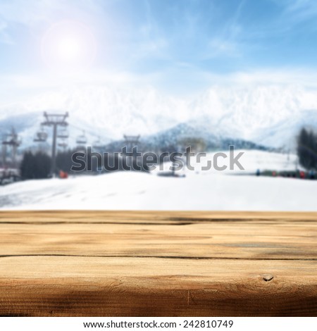 wooden desk and slope lift in alps
