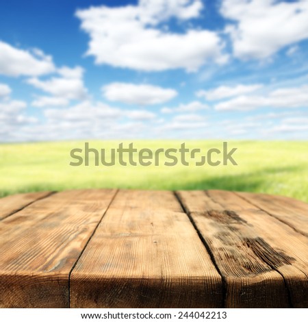 spring background of meadow sky and your free space on big table top