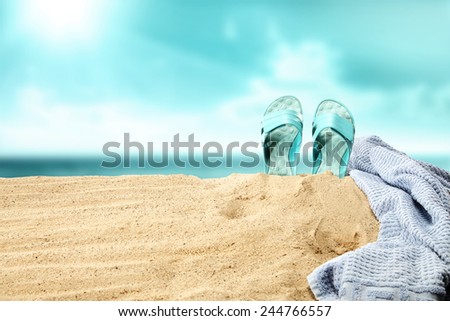 shoes towel and space of sand