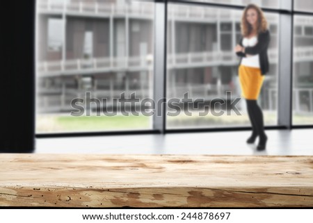 interior of office with window and modern landscape of city and desk of wood and free space