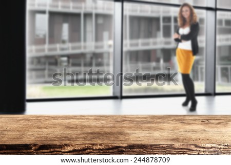 interior of office with window and modern landscape of city and dark brown old table