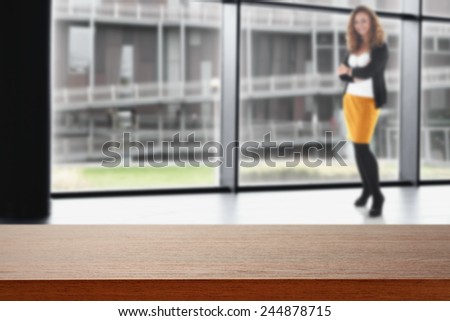 interior of office with window and modern landscape of city and dark desk