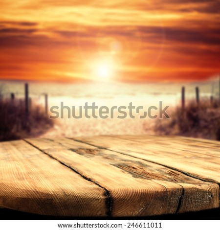worn table space and sunset with beach
