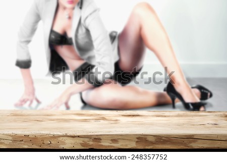 background with woman in background on the floor and desk of wood