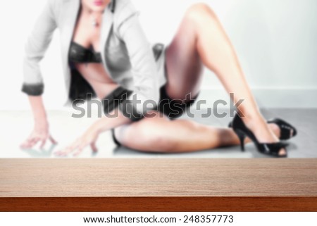 background with woman in background on the floor and brown red desk top place