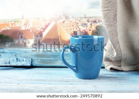 blue mug and blue window space