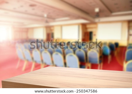 yellow wooden desk space and sun light in room of chairs