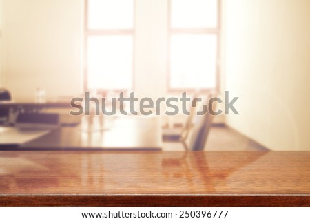 interior of office with window and table with chair and brown desk