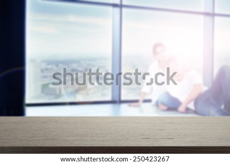 black desk of free space and woman with man on floor and window space