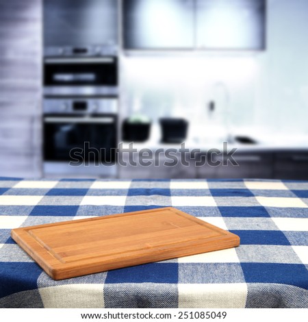 blue tablecloth and brown color of desk and furniture space