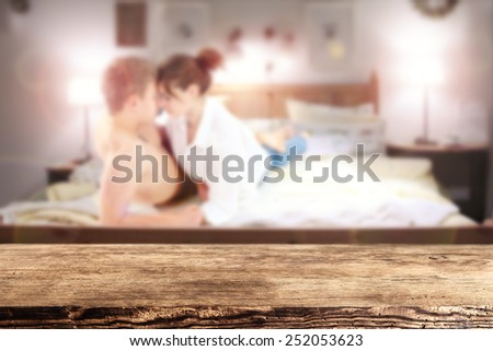 dark brown desk and lovers in bed