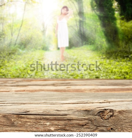 spring or summer background of garden with worn old top of wood
