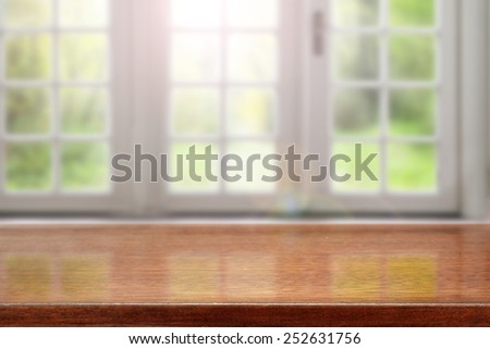 brown desk and window space