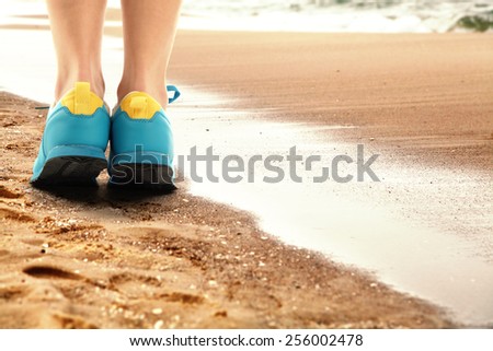 blue shoes and sand
