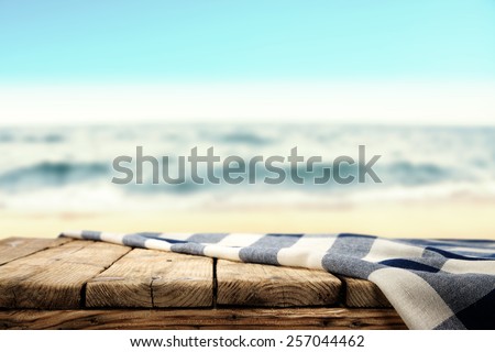 tablecloth and table of wood and sea