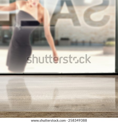 woman in black storefront and window
