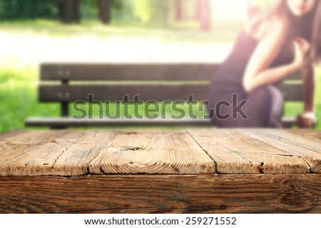 worn old table and park space