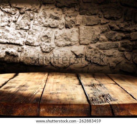 shadow on table of wood and wall of dark shadow
