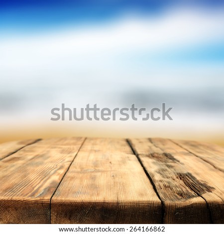 background of summer and worn old big brown table