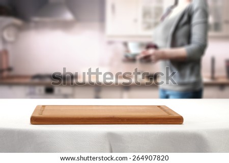 retro kitchen and woman with tablecloth of white