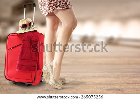 suitcase legs and glasses of red color