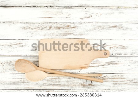 desk and spoons on white table